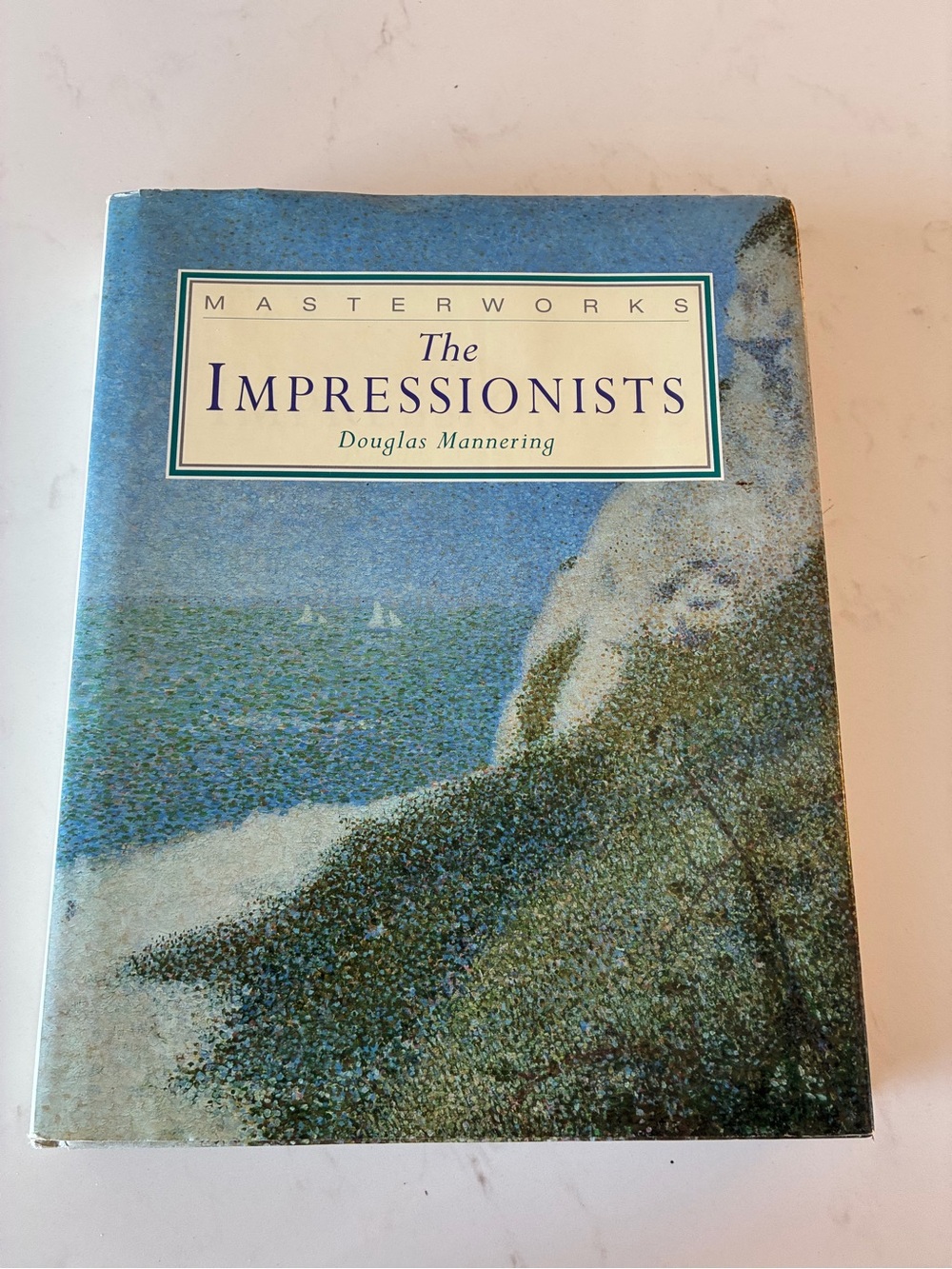 Vintage hardcover art book titled Masterworks: The Impressionists by Douglas Man